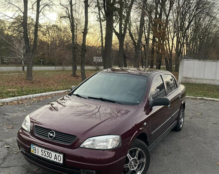 Красный Опель Астра, объемом двигателя 1.39 л и пробегом 187 тыс. км за 4800 $, фото 1 на Automoto.ua