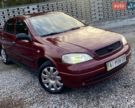 Красный Опель Астра, объемом двигателя 1.36 л и пробегом 255 тыс. км за 3000 $, фото 1 на Automoto.ua