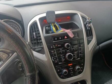 Красный Опель Астра, объемом двигателя 1.25 л и пробегом 319 тыс. км за 5000 $, фото 1 на Automoto.ua