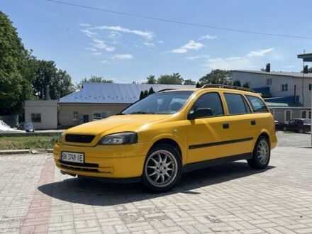 Желтый Опель Астра, объемом двигателя 1.2 л и пробегом 220 тыс. км за 2200 $, фото 1 на Automoto.ua