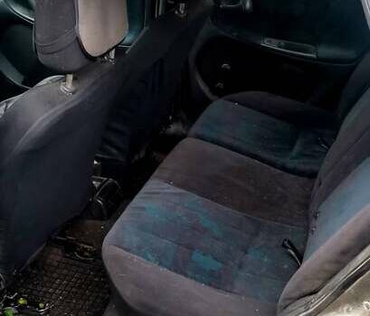 Серый Опель Астра, объемом двигателя 1.4 л и пробегом 280 тыс. км за 1350 $, фото 6 на Automoto.ua