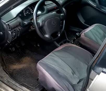 Серый Опель Астра, объемом двигателя 1.4 л и пробегом 280 тыс. км за 1350 $, фото 5 на Automoto.ua