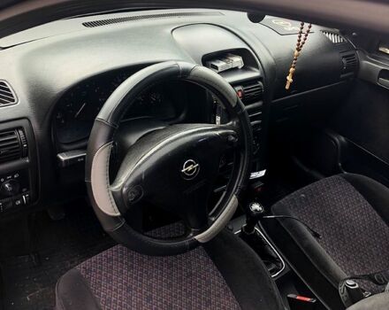 Серый Опель Астра, объемом двигателя 1.4 л и пробегом 195 тыс. км за 3100 $, фото 7 на Automoto.ua