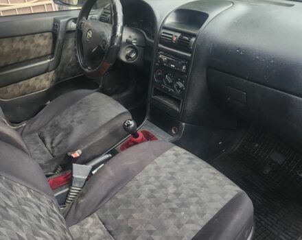 Серый Опель Астра, объемом двигателя 2 л и пробегом 300 тыс. км за 980 $, фото 7 на Automoto.ua