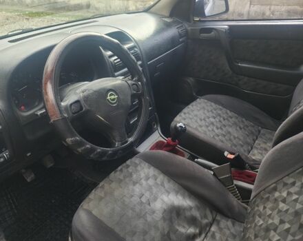 Серый Опель Астра, объемом двигателя 2 л и пробегом 300 тыс. км за 980 $, фото 6 на Automoto.ua