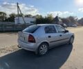 Серый Опель Астра, объемом двигателя 1.2 л и пробегом 255 тыс. км за 2298 $, фото 3 на Automoto.ua