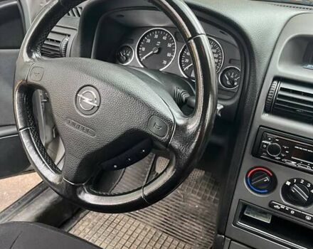 Серый Опель Астра, объемом двигателя 1.6 л и пробегом 110 тыс. км за 3600 $, фото 9 на Automoto.ua