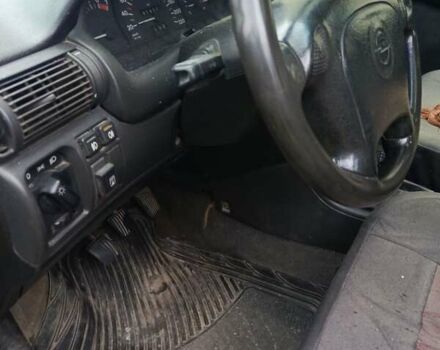 Серый Опель Астра, объемом двигателя 1.4 л и пробегом 185 тыс. км за 1400 $, фото 1 на Automoto.ua