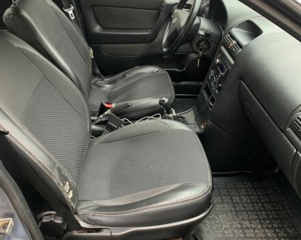 Серый Опель Астра, объемом двигателя 1.4 л и пробегом 224 тыс. км за 2300 $, фото 6 на Automoto.ua