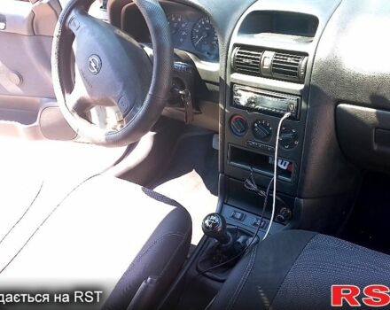 Серый Опель Астра, объемом двигателя 1.4 л и пробегом 215 тыс. км за 3800 $, фото 2 на Automoto.ua