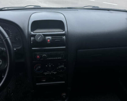 Серый Опель Астра, объемом двигателя 1.4 л и пробегом 300 тыс. км за 5000 $, фото 10 на Automoto.ua