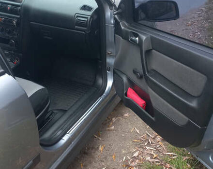 Серый Опель Астра, объемом двигателя 1.4 л и пробегом 212 тыс. км за 3900 $, фото 5 на Automoto.ua