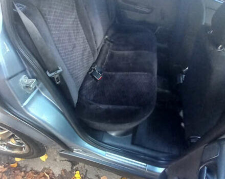 Серый Опель Астра, объемом двигателя 1.4 л и пробегом 212 тыс. км за 3900 $, фото 9 на Automoto.ua