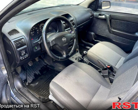 Серый Опель Астра, объемом двигателя 1.4 л и пробегом 250 тыс. км за 2999 $, фото 10 на Automoto.ua