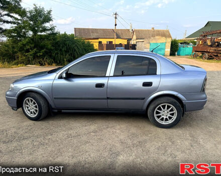 Серый Опель Астра, объемом двигателя 1.4 л и пробегом 200 тыс. км за 3600 $, фото 4 на Automoto.ua