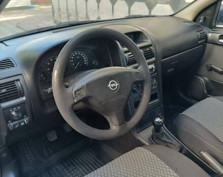 Серый Опель Астра, объемом двигателя 1.4 л и пробегом 189 тыс. км за 3900 $, фото 12 на Automoto.ua
