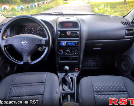 Серый Опель Астра, объемом двигателя 1.4 л и пробегом 198 тыс. км за 3500 $, фото 9 на Automoto.ua