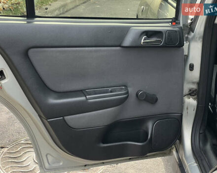 Серый Опель Астра, объемом двигателя 1.36 л и пробегом 77 тыс. км за 3999 $, фото 37 на Automoto.ua