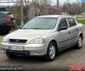 Серый Опель Астра, объемом двигателя 1.4 л и пробегом 250 тыс. км за 2999 $, фото 1 на Automoto.ua