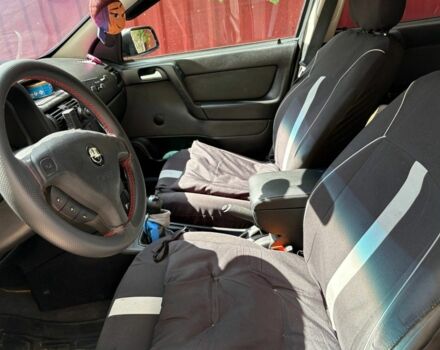 Серый Опель Астра, объемом двигателя 1.4 л и пробегом 201 тыс. км за 3600 $, фото 12 на Automoto.ua