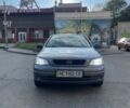 Серый Опель Астра, объемом двигателя 1.4 л и пробегом 255 тыс. км за 3500 $, фото 2 на Automoto.ua