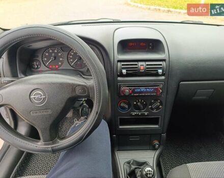 Серый Опель Астра, объемом двигателя 1.4 л и пробегом 77 тыс. км за 4400 $, фото 12 на Automoto.ua