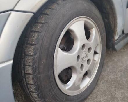 Серый Опель Астра, объемом двигателя 2 л и пробегом 403 тыс. км за 2600 $, фото 8 на Automoto.ua