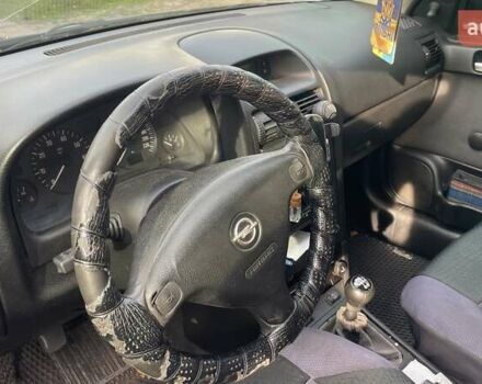 Серый Опель Астра, объемом двигателя 1.6 л и пробегом 190 тыс. км за 3400 $, фото 7 на Automoto.ua