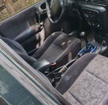 Серый Опель Астра, объемом двигателя 2 л и пробегом 178 тыс. км за 2550 $, фото 1 на Automoto.ua