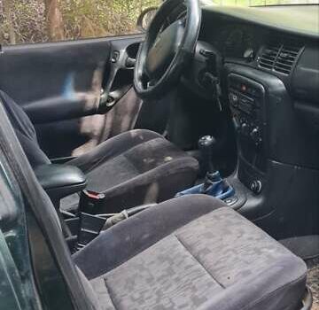 Серый Опель Астра, объемом двигателя 2 л и пробегом 178 тыс. км за 2550 $, фото 8 на Automoto.ua