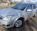 Серый Опель Астра, объемом двигателя 1.2 л и пробегом 210 тыс. км за 5600 $, фото 2 на Automoto.ua