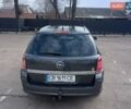 Серый Опель Астра, объемом двигателя 1.4 л и пробегом 210 тыс. км за 4900 $, фото 3 на Automoto.ua
