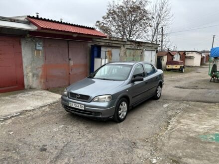 Серый Опель Астра, объемом двигателя 1.4 л и пробегом 220 тыс. км за 3200 $, фото 1 на Automoto.ua