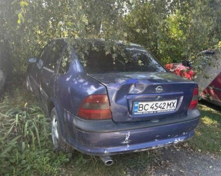 Синий Опель Астра, объемом двигателя 1.8 л и пробегом 249 тыс. км за 600 $, фото 2 на Automoto.ua
