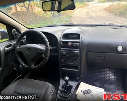 Синий Опель Астра, объемом двигателя 1.2 л и пробегом 218 тыс. км за 3180 $, фото 4 на Automoto.ua