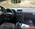 Синий Опель Астра, объемом двигателя 1.2 л и пробегом 218 тыс. км за 3180 $, фото 4 на Automoto.ua