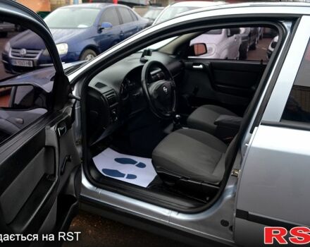 Синий Опель Астра, объемом двигателя 14 л и пробегом 150 тыс. км за 4100 $, фото 5 на Automoto.ua