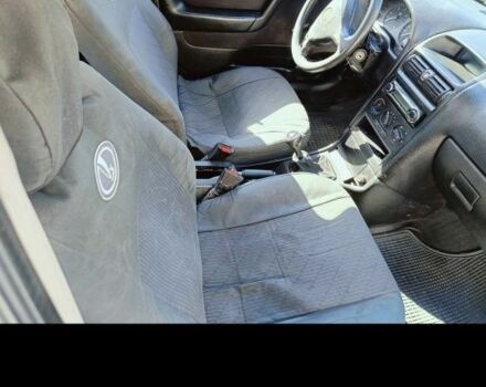 Синий Опель Астра, объемом двигателя 2 л и пробегом 250 тыс. км за 1100 $, фото 2 на Automoto.ua