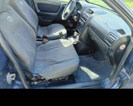 Синий Опель Астра, объемом двигателя 2 л и пробегом 250 тыс. км за 1100 $, фото 1 на Automoto.ua