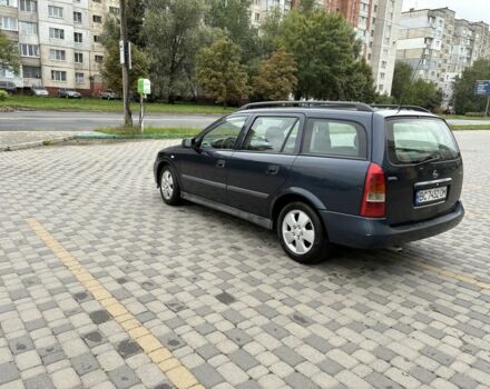 Синий Опель Астра, объемом двигателя 2 л и пробегом 318 тыс. км за 3450 $, фото 1 на Automoto.ua