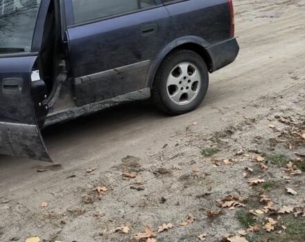 Синий Опель Астра, объемом двигателя 2 л и пробегом 300 тыс. км за 870 $, фото 2 на Automoto.ua