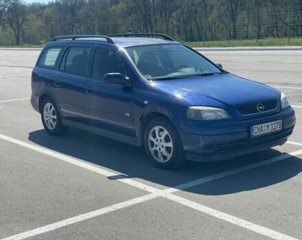 Синий Опель Астра, объемом двигателя 2 л и пробегом 320 тыс. км за 1200 $, фото 1 на Automoto.ua