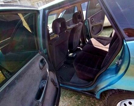 Зеленый Опель Астра, объемом двигателя 1.4 л и пробегом 400 тыс. км за 670 $, фото 3 на Automoto.ua