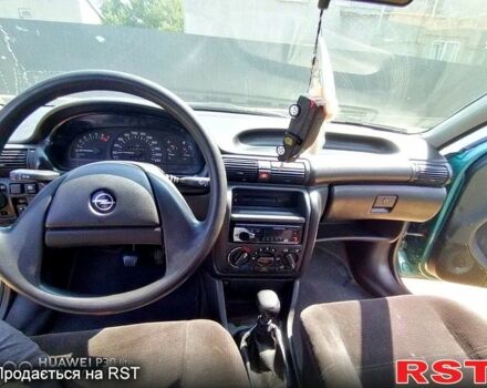 Зеленый Опель Астра, объемом двигателя 1.4 л и пробегом 400 тыс. км за 670 $, фото 4 на Automoto.ua