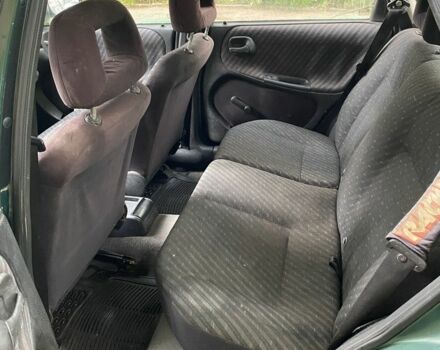 Зеленый Опель Астра, объемом двигателя 1.4 л и пробегом 342 тыс. км за 642 $, фото 4 на Automoto.ua