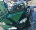 Зеленый Опель Астра, объемом двигателя 1.4 л и пробегом 260 тыс. км за 1558 $, фото 1 на Automoto.ua