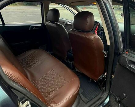 Зеленый Опель Астра, объемом двигателя 1.4 л и пробегом 235 тыс. км за 3000 $, фото 4 на Automoto.ua