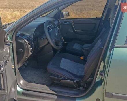 Зелений Опель Астра, об'ємом двигуна 1.39 л та пробігом 320 тис. км за 3400 $, фото 23 на Automoto.ua