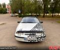 Білий Опель Калібра, об'ємом двигуна 2 л та пробігом 300 тис. км за 1800 $, фото 1 на Automoto.ua