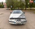 Белый Опель Калибра, объемом двигателя 2 л и пробегом 300 тыс. км за 1000 $, фото 1 на Automoto.ua